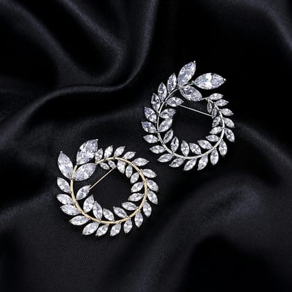 White gold earrings shaped as wreaths of marquise diamonds, on black satin