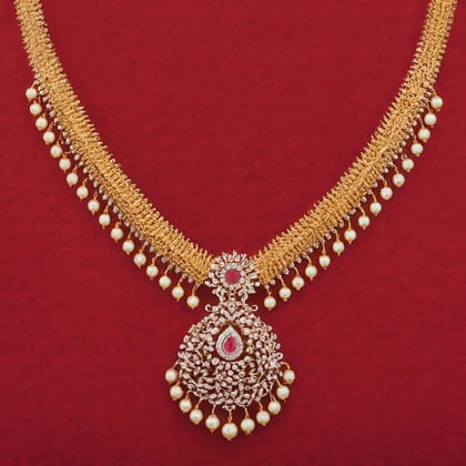 Gold necklace edged with pearls, with a ruby-centred pendant, on red cloth